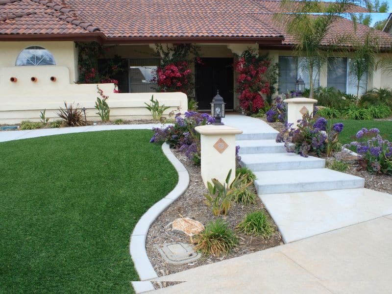 front yard garden ideas with flowers, lights and pathway
